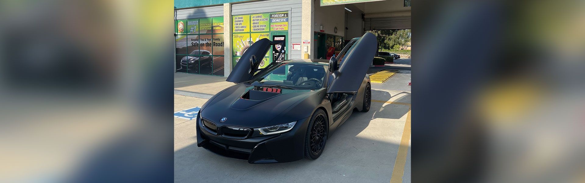 Sports car with vertical opening doors | Rancho Express Lube