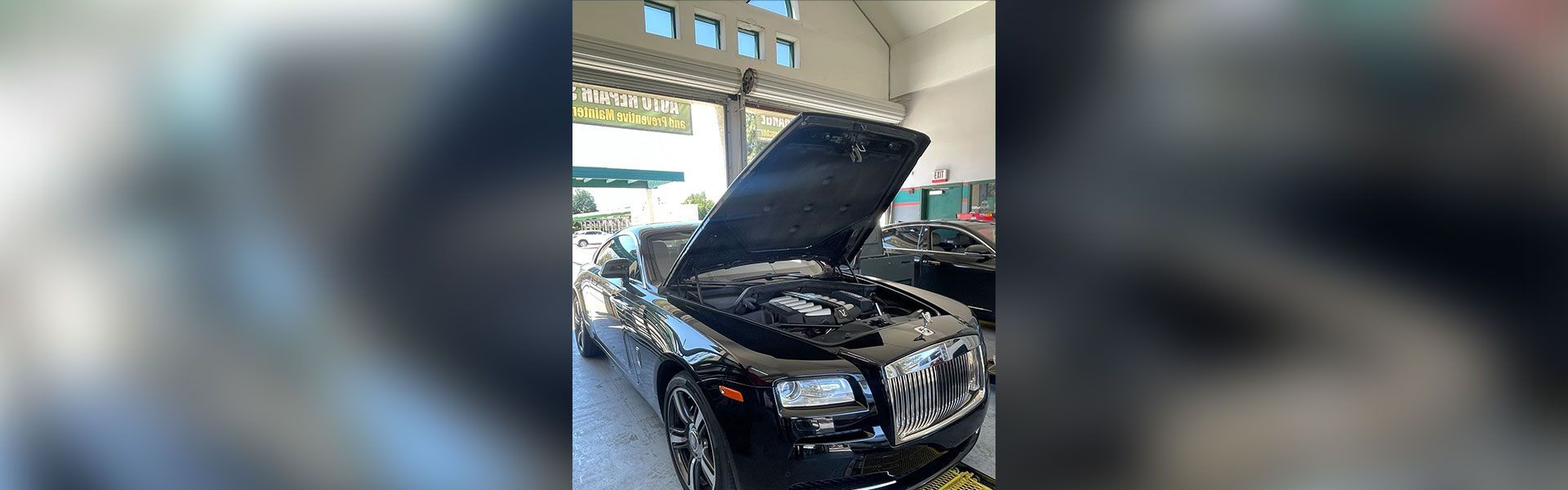 Luxury car being worked on in shop | Rancho Express Lube