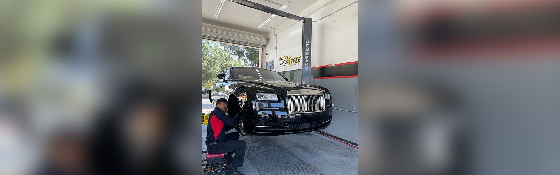 Luxury car on lift | Rancho Express Lube