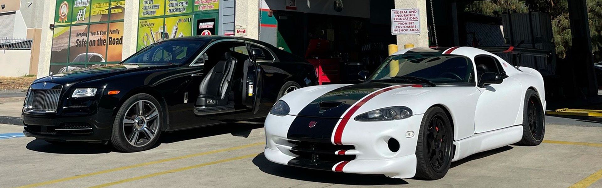 Sports cars displayed in front of shop | Rancho Express Lube