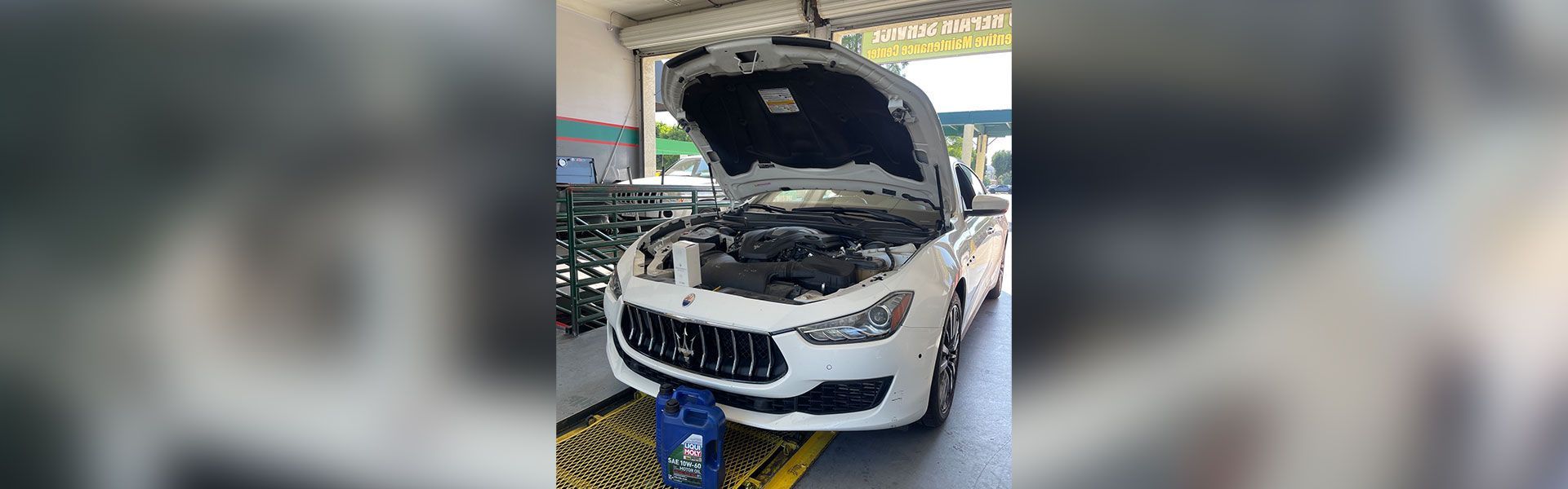 White car getting oil changed | Rancho Express Lube