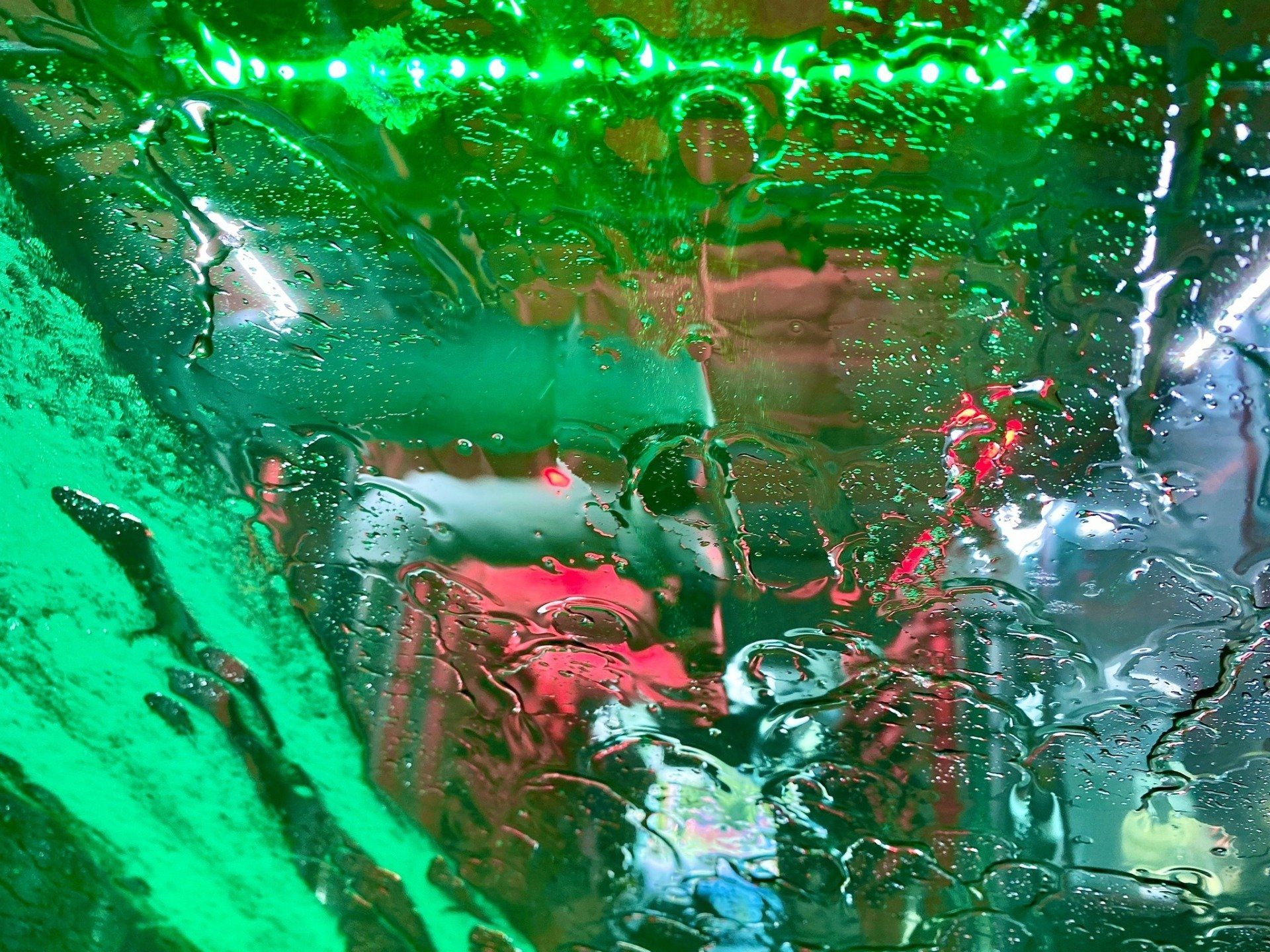 water and soap running down a windsheild