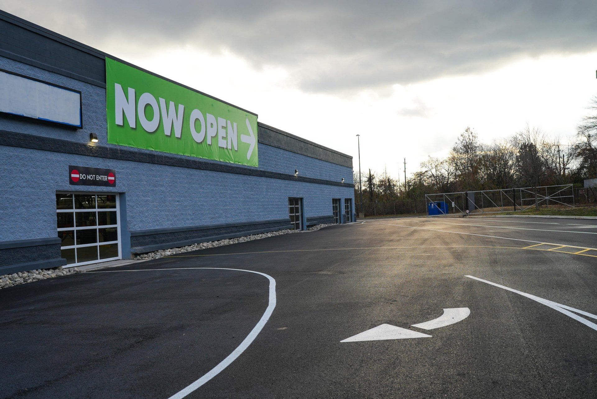 car wash building with banner that says 