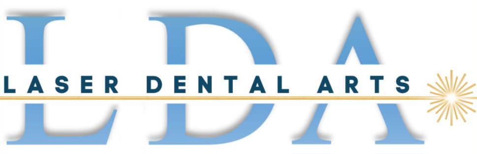 Logo for Laser Dental Arts, featuring light blue "LDA" over text "LASER DENTAL ARTS." A golden line with sunburst.