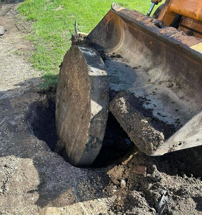 A bulldozer is digging a hole in the ground.