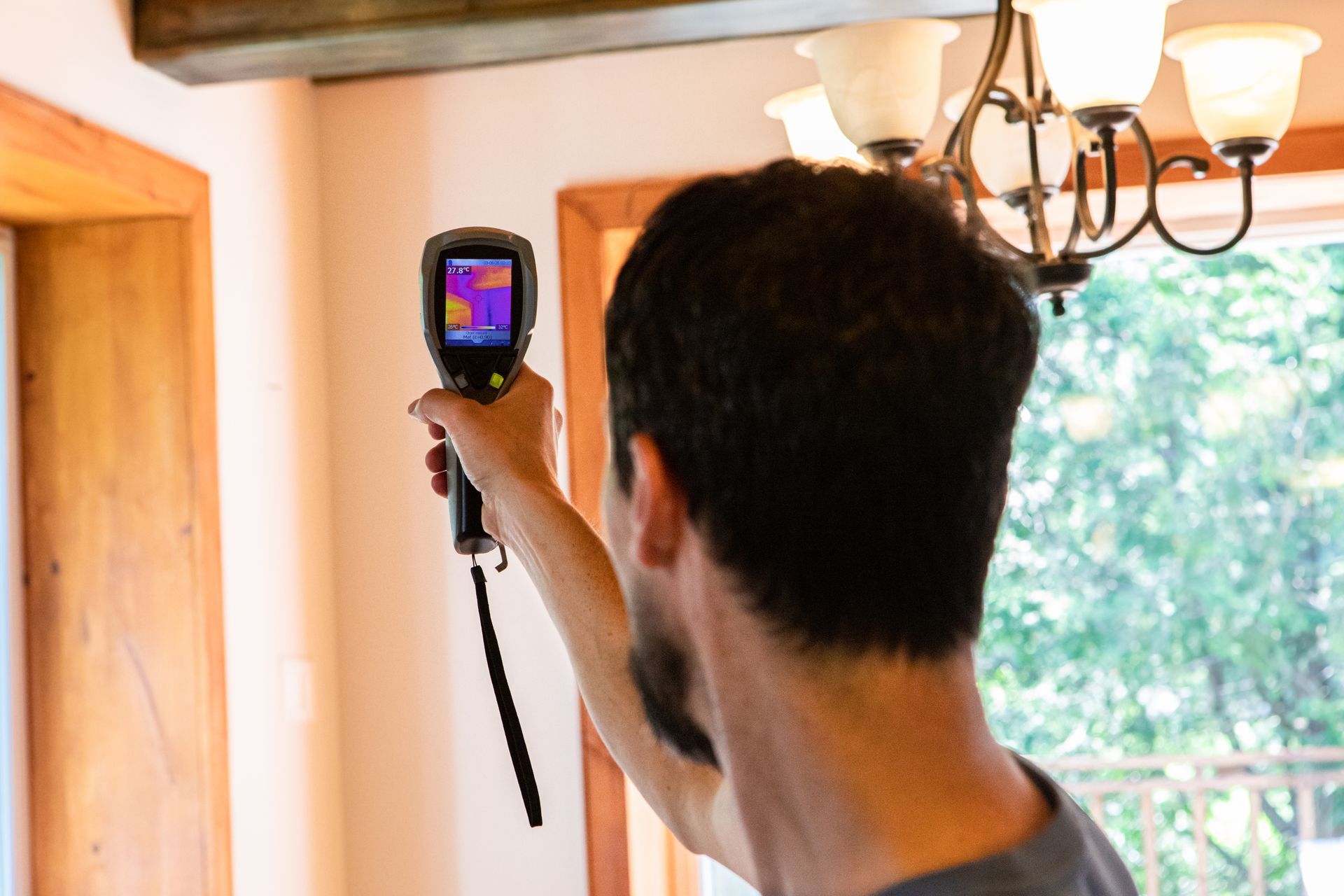 Hand pointing at virtual air quality gauge near a laptop. Hand pointing at virtual air quality gauge near a laptop.