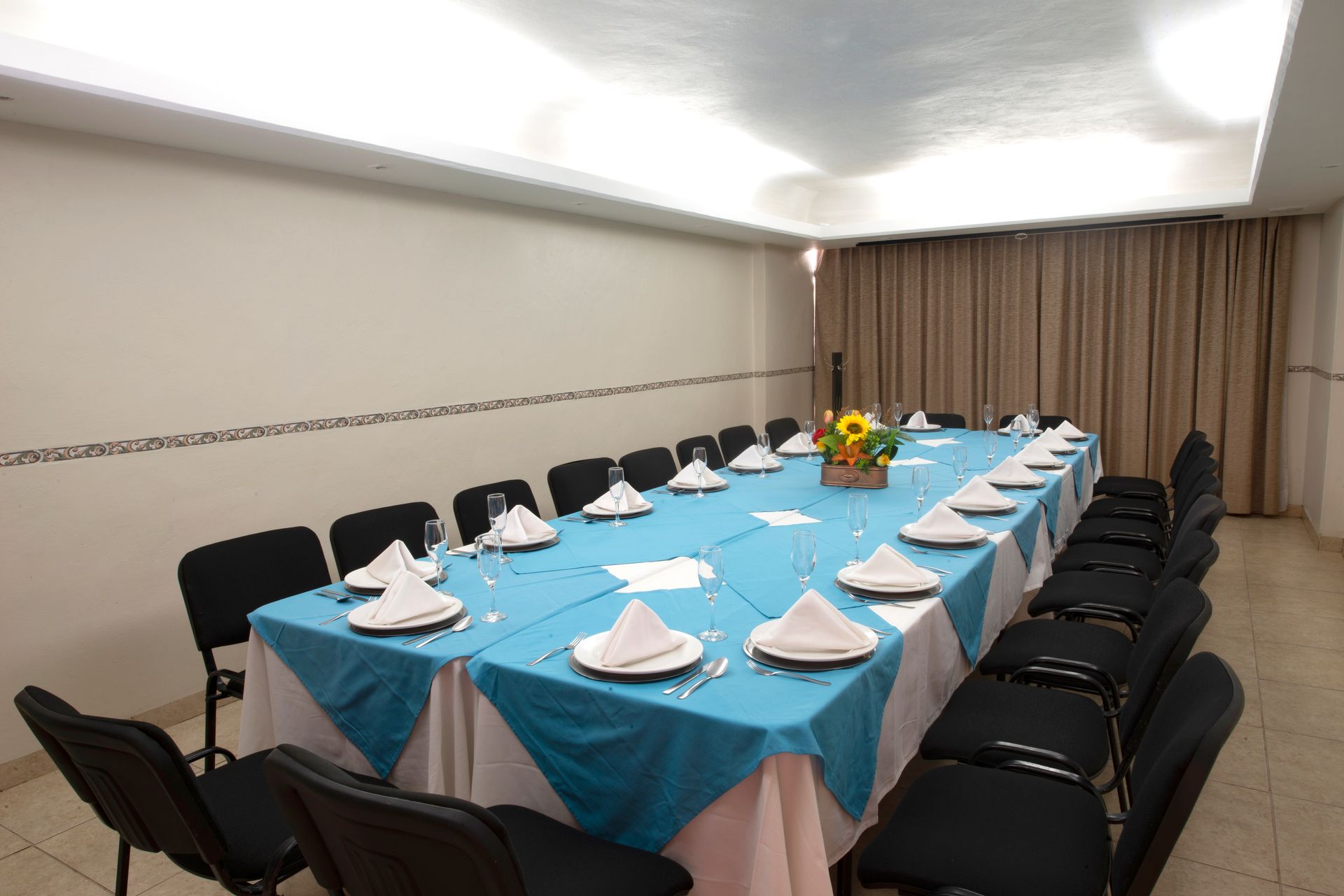 A long table with plates and napkins on it