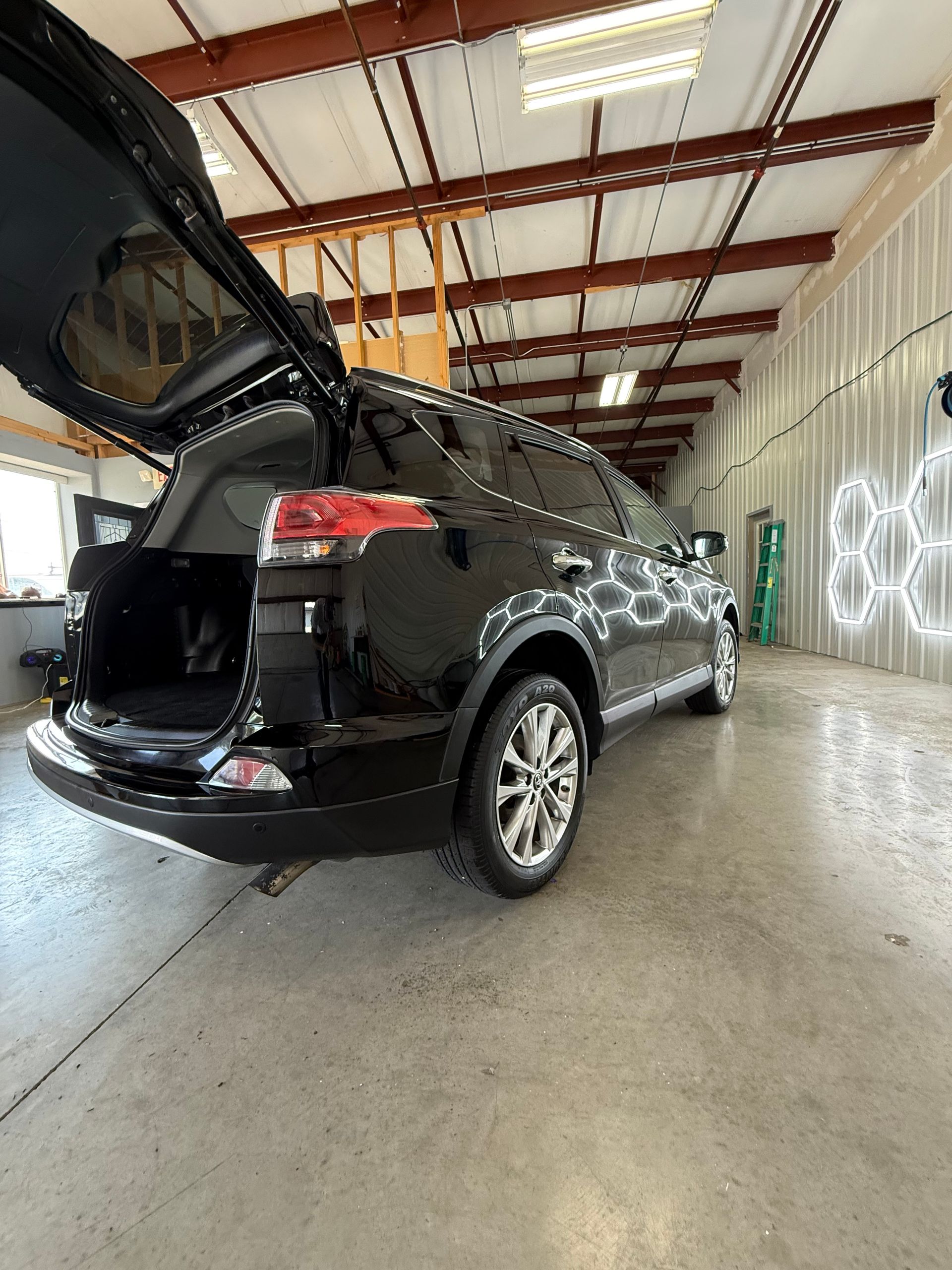 Black SUV auto detailing and polishing in Antioch IL by Captain Coles Detailing.