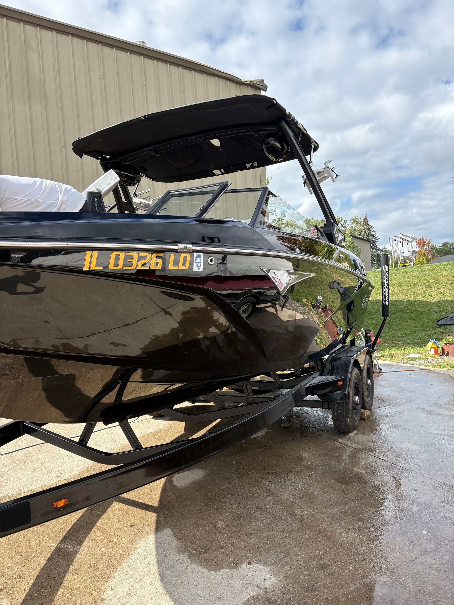 Black wake boat exterior detailing and polishing in Antioch IL by Captain Coles Detailing.