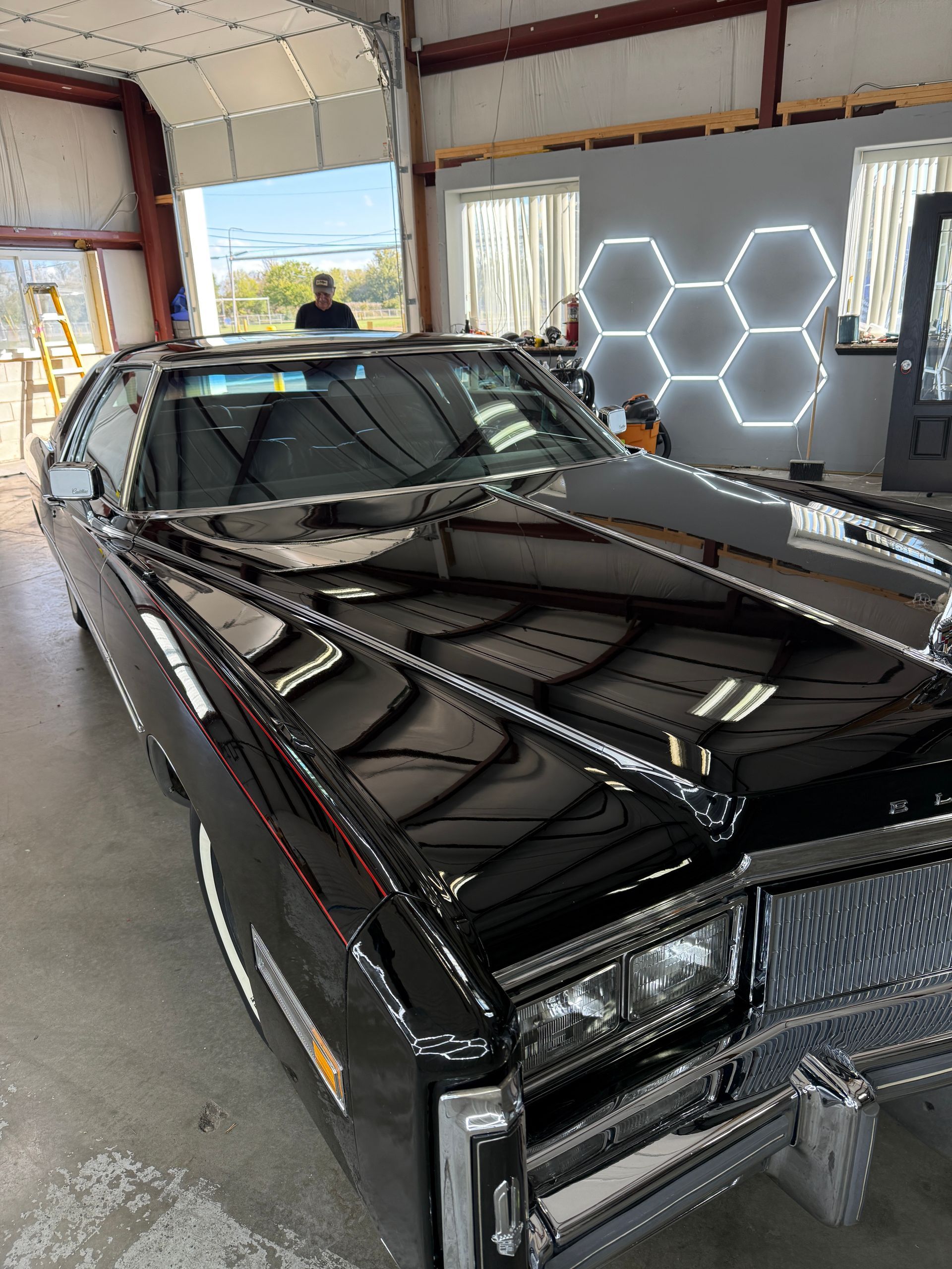 Black car paint correction and scratch removal in Antioch IL by Captain Coles Detailing.