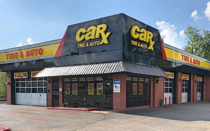 CarX Tire & Auto shop with black and yellow signage and garage bays.
