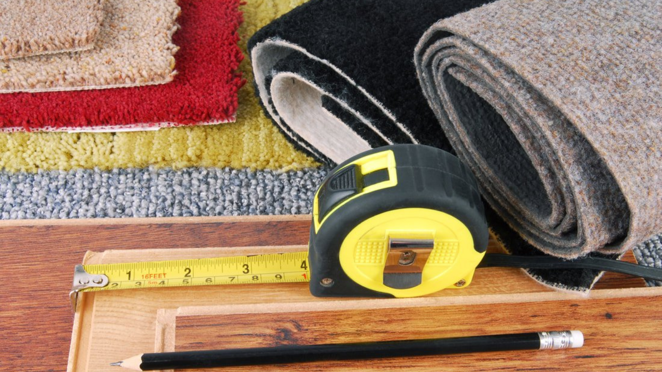 Floor with gray marbled pattern and yellow walls. Two pipes and a drain protrude from the floor.
