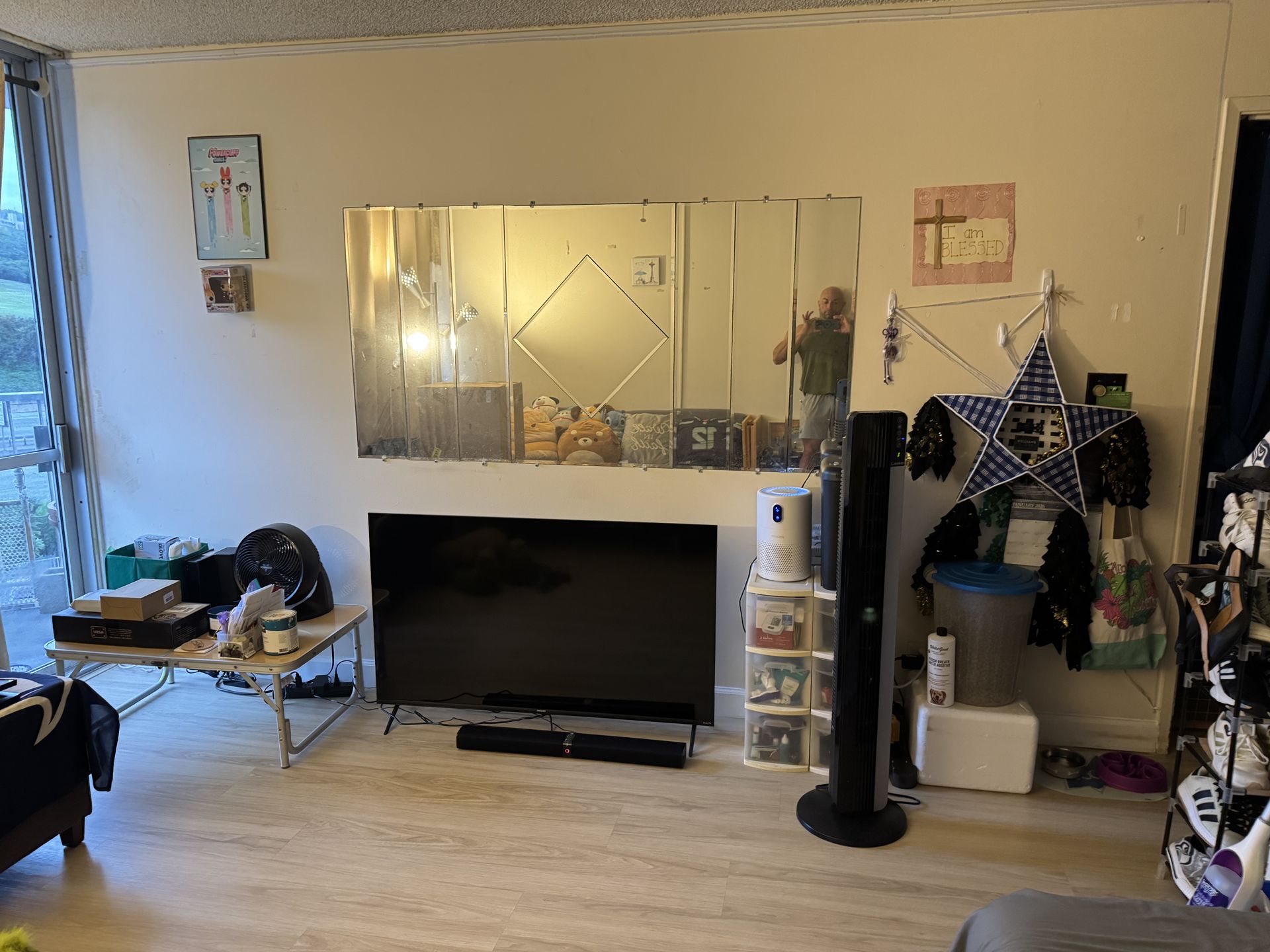 A man is using a drill to drill a hole in a piece of wood.