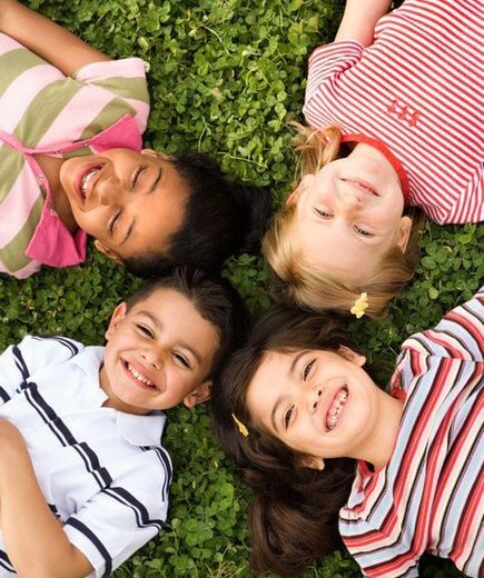 Group of Kindergarten Kids Lying on the Grass — Child Care in Rock Island, IL