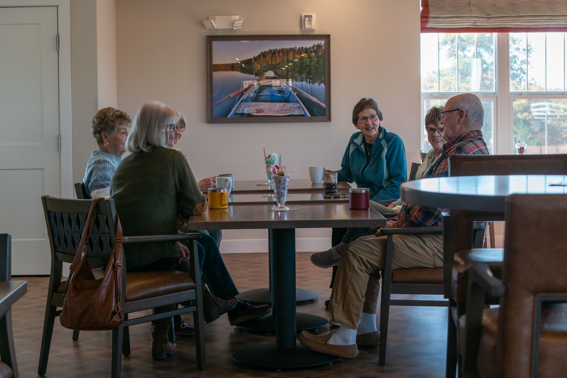 Gracewin Members visiting over coffee in the Sunset Lounge.