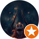 A picture of a demon with horns in a circle with an orange star.