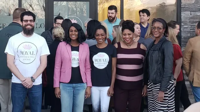 Group of people in front of a building with 