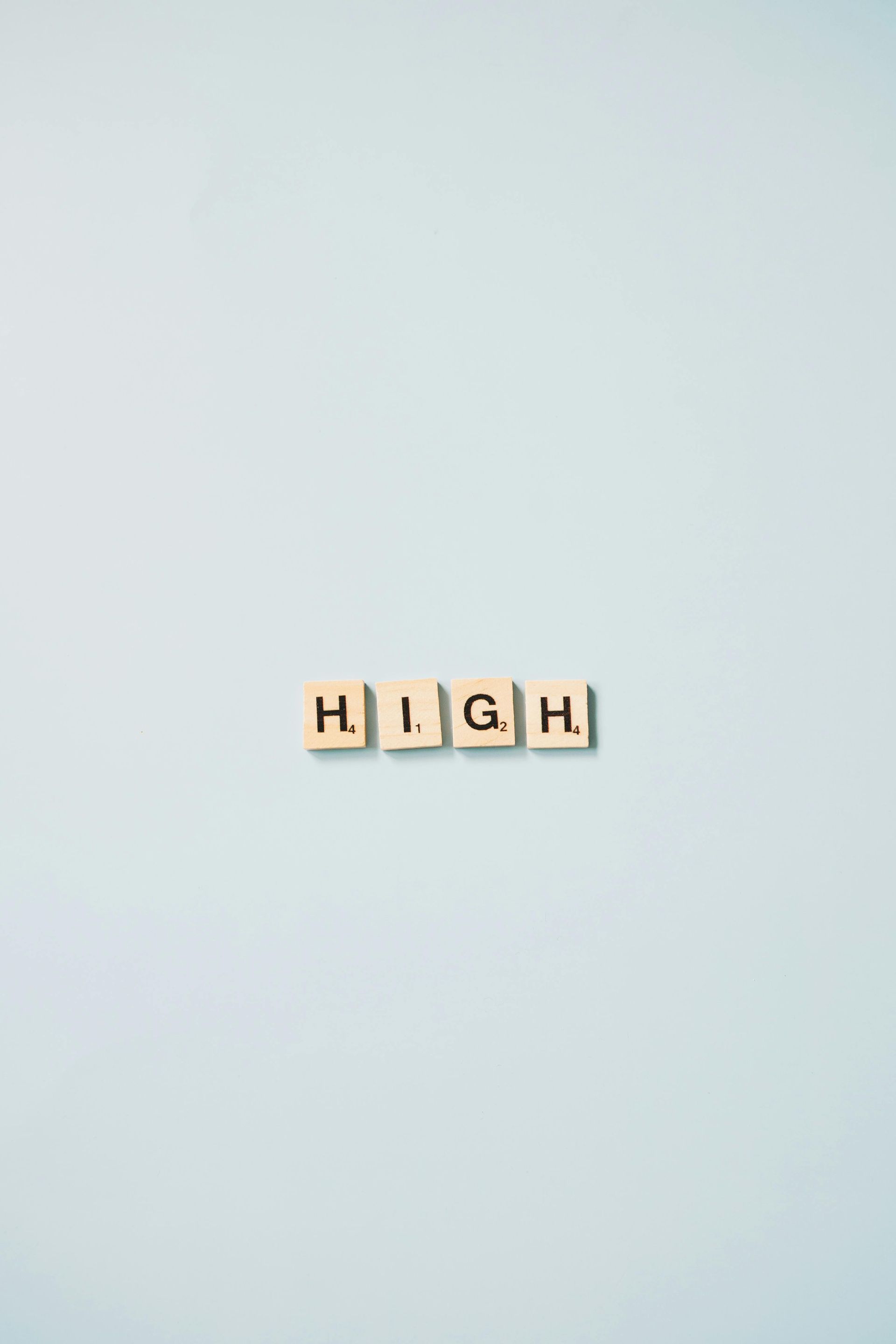 The word high is written in scrabble tiles on a white background.