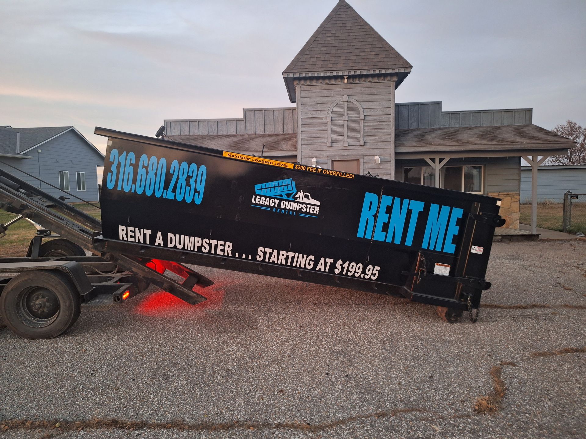 A dumpster with the words rent me on it