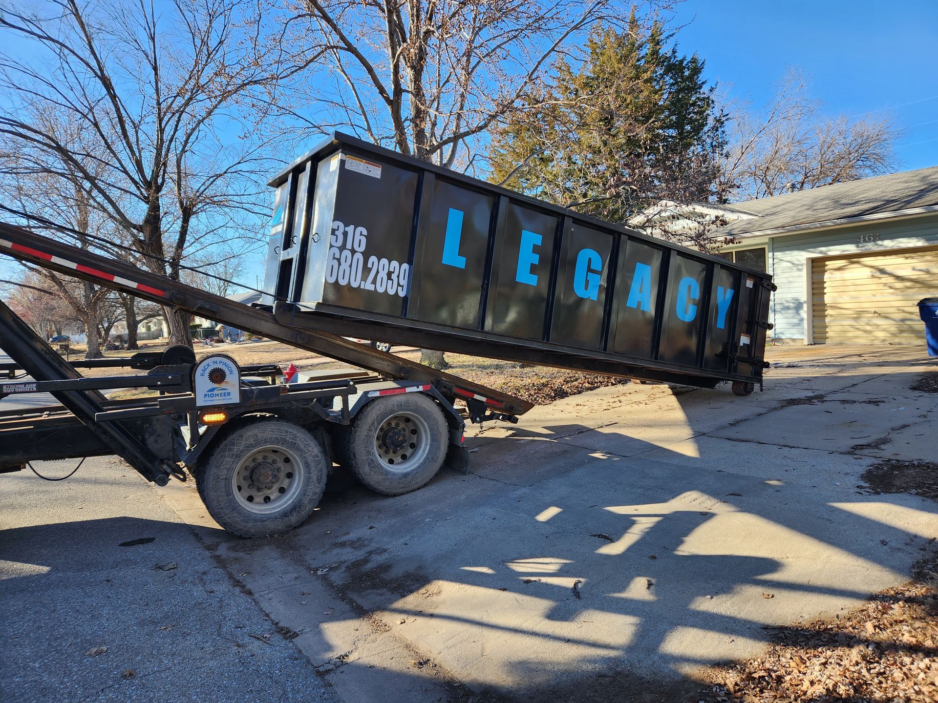 A 40 yard dumpster being dropped off in a customers driveway in Wichita, KS.