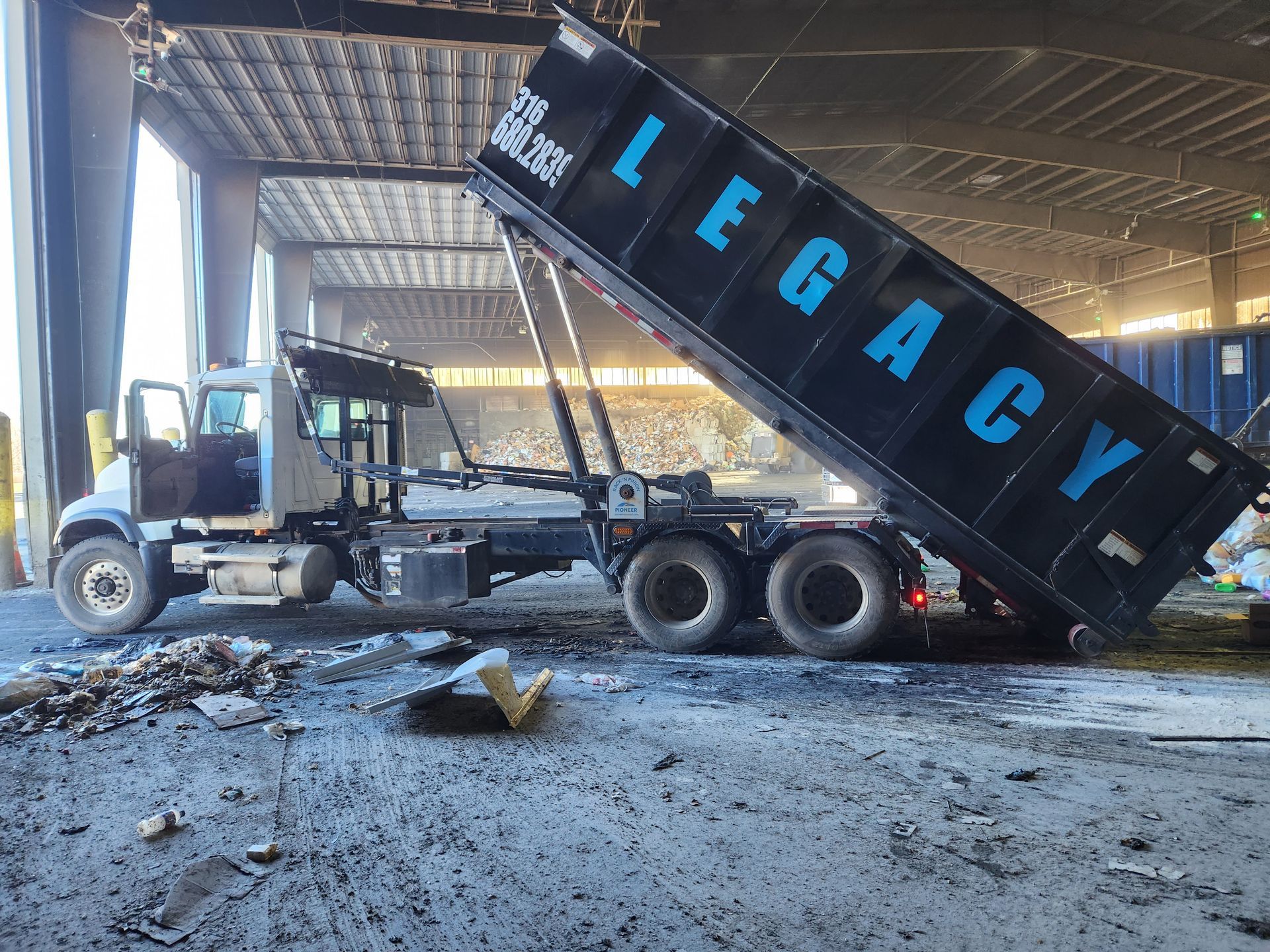 A dump truck with the word legacy on it
