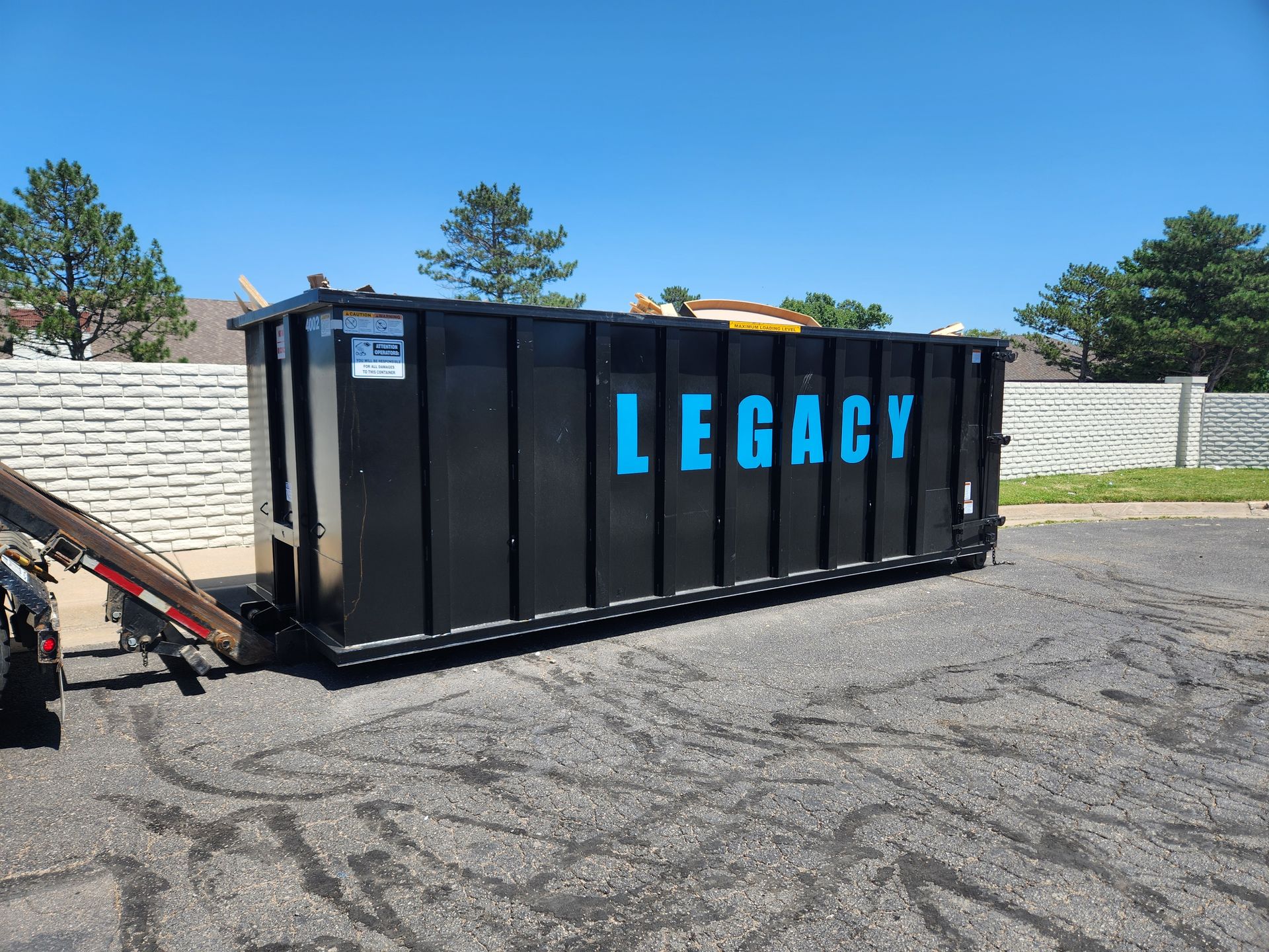 A dumpster with the word legacy on it