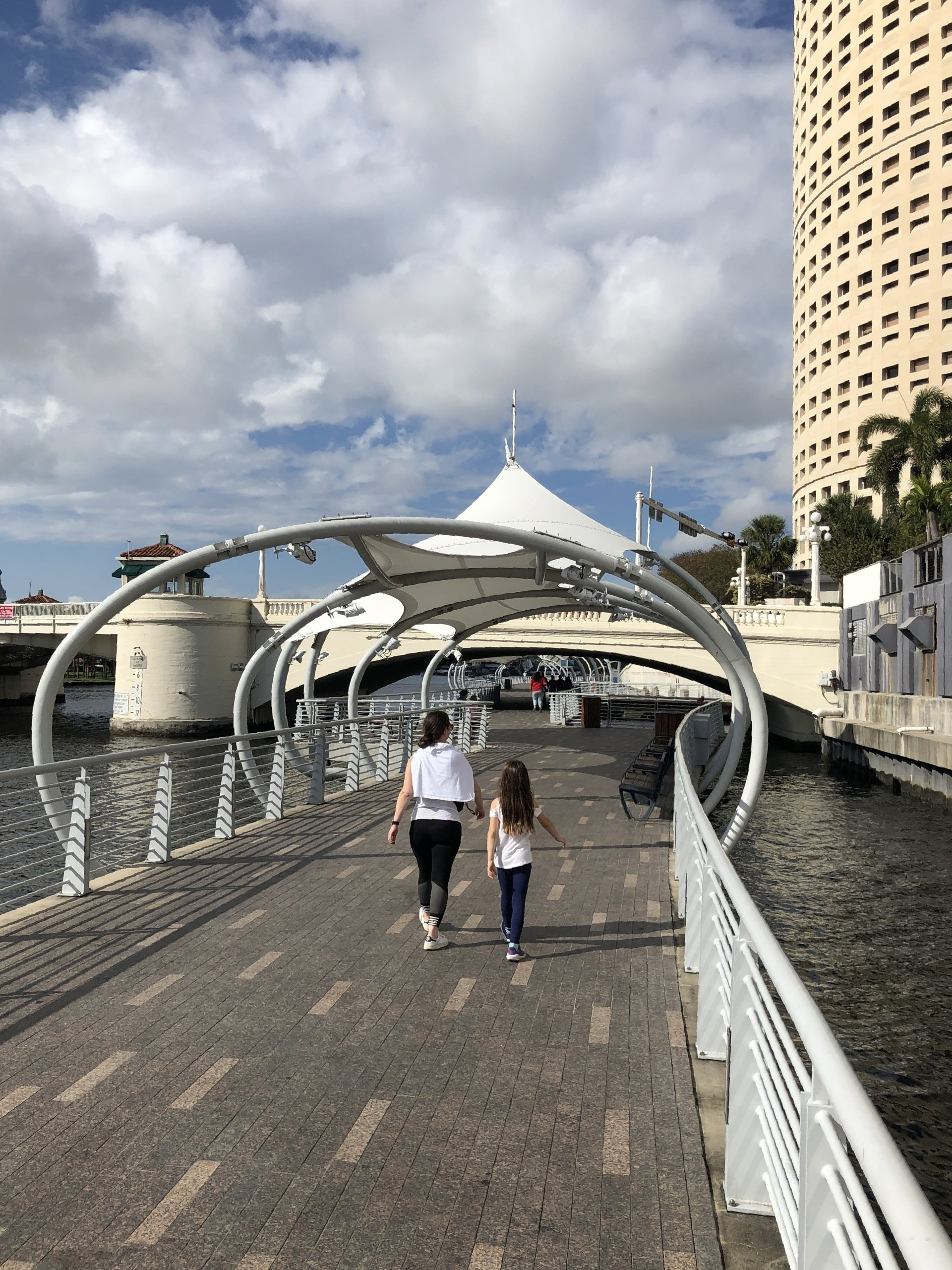 Downtown Tampa with Riverwalk along the Hillsborough River, waterfront view, and the distinctive Sykes building