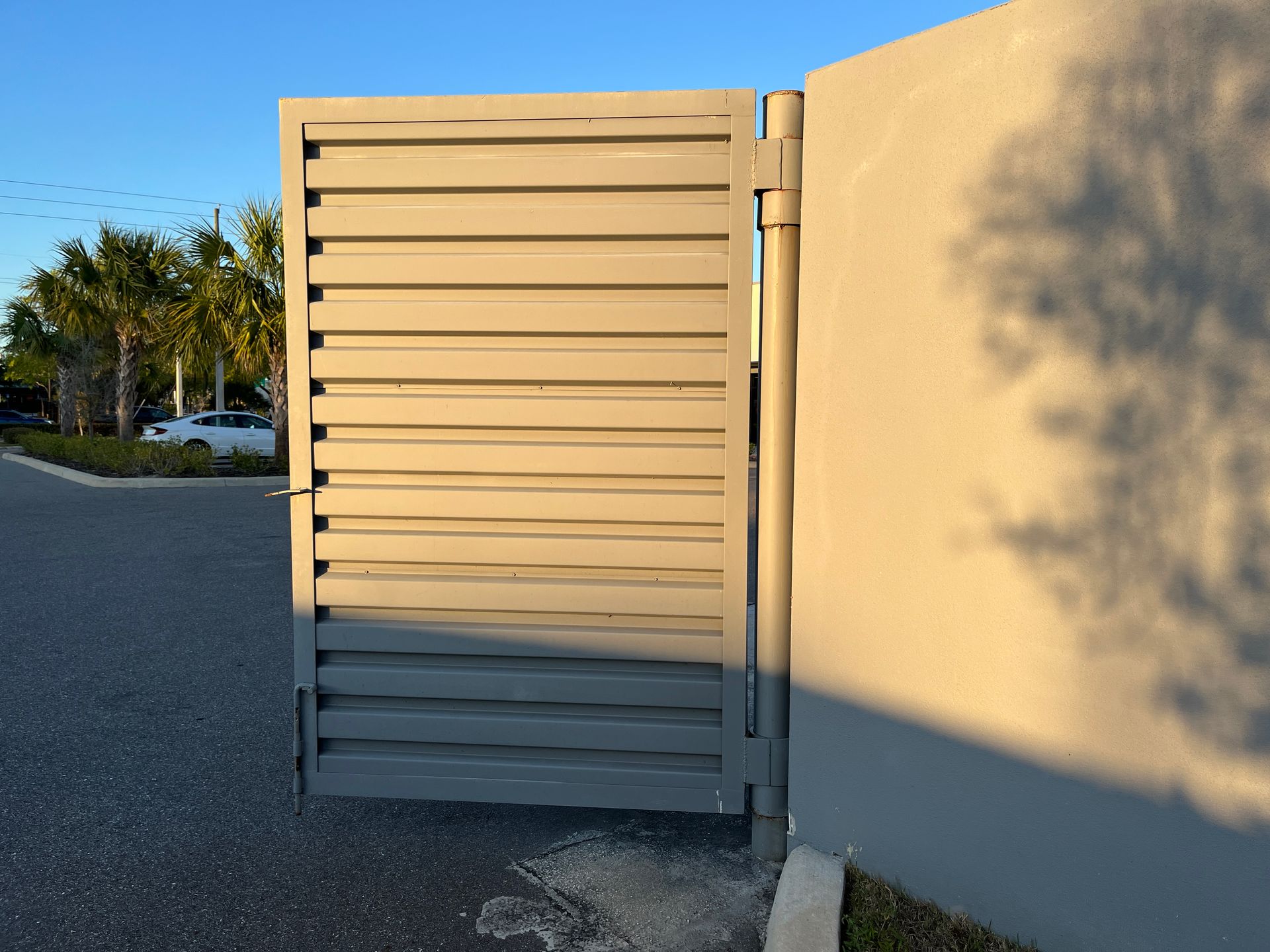 trash door mounted on pole installed in concrete