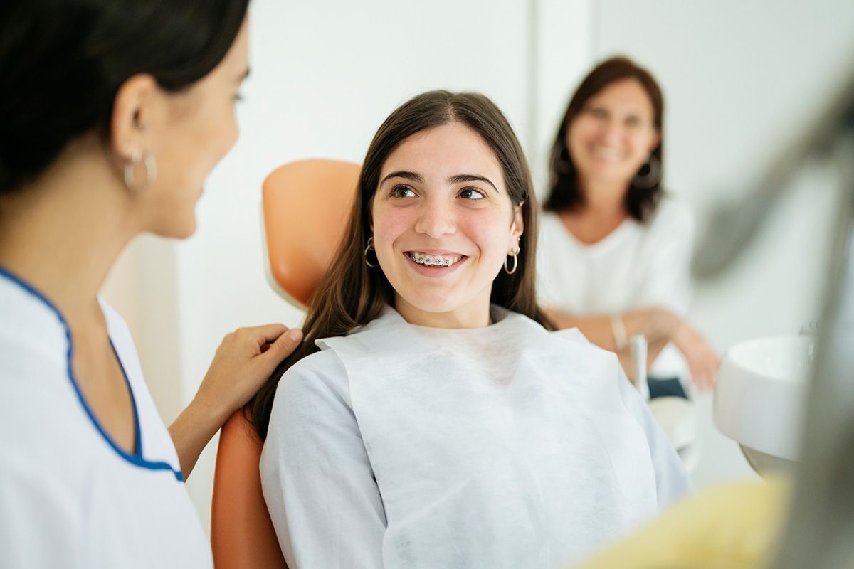 Patient Smiling at Female Dentist — Pinetop, AZ — Blue Ridge Family Dentistry PC