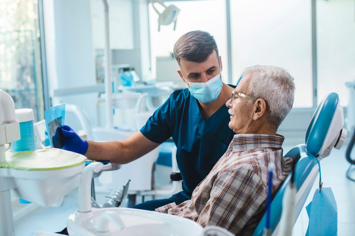 Senior Man Sitting in a Dental Chair — Pinetop, AZ — Blue Ridge Family Dentistry PC