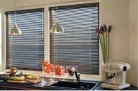Aluminium Blinds fitted in a contemporary kitchen window, offering privacy, durability, and easy light adjustment.
