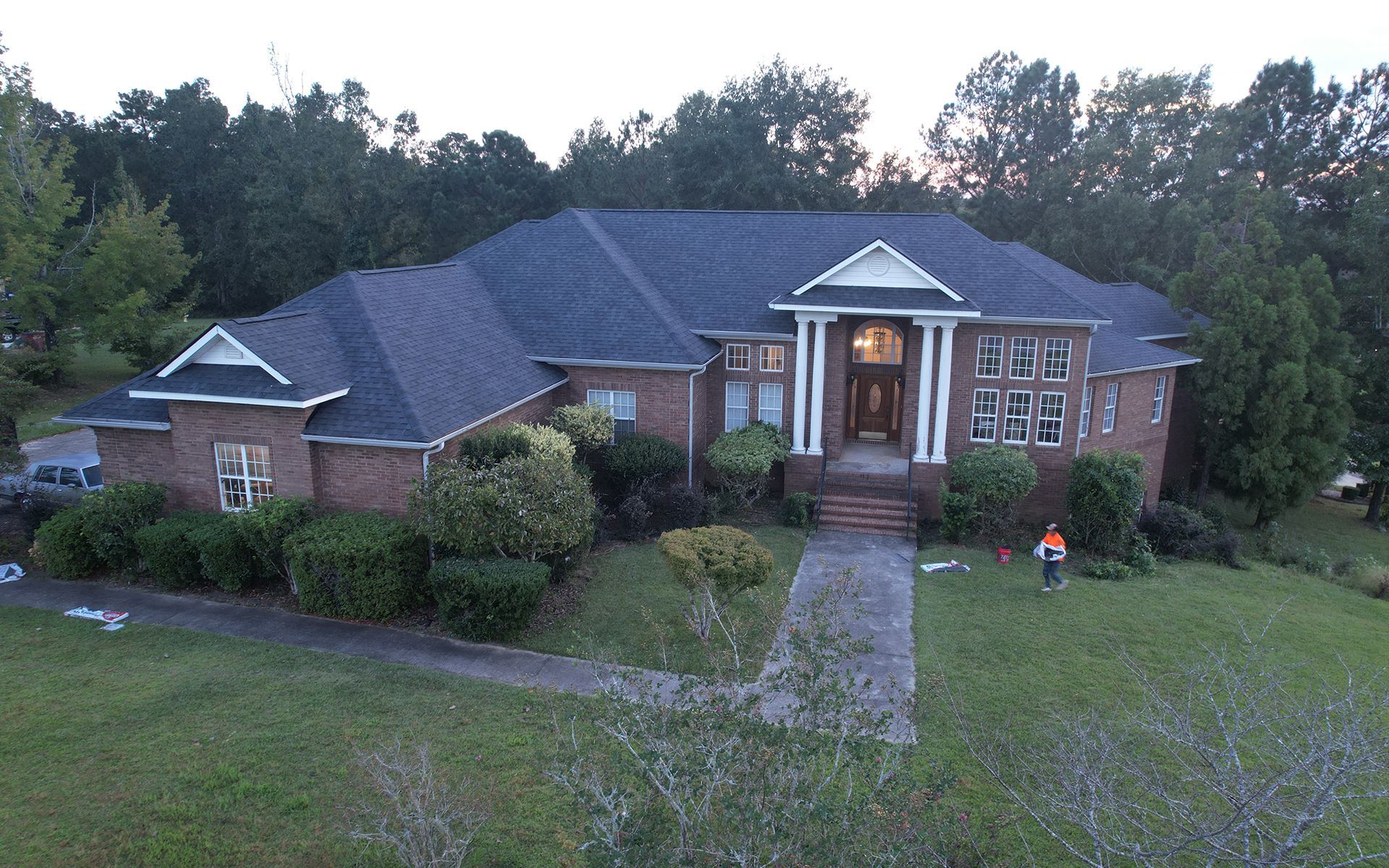 Comparing roof repair vs replacement on residential home