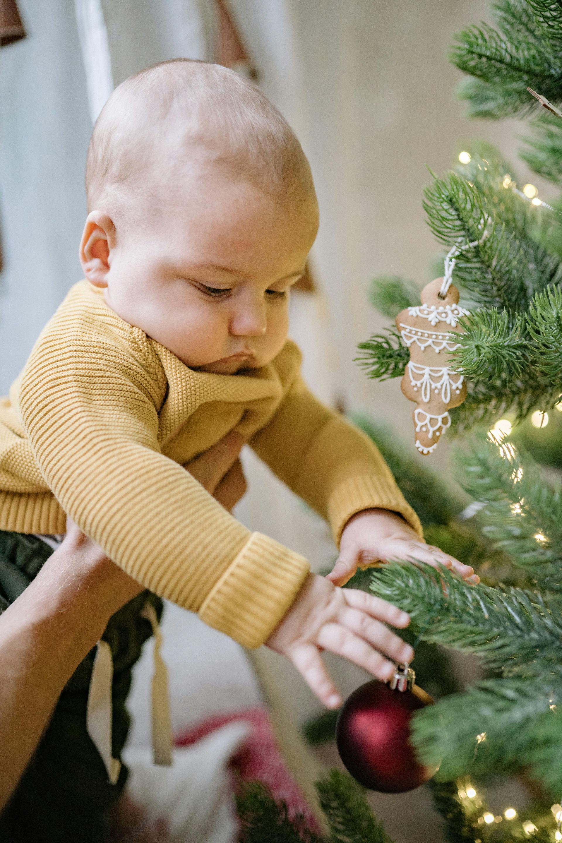 New parents celebrating the holidays with their baby, embracing calm and connection.