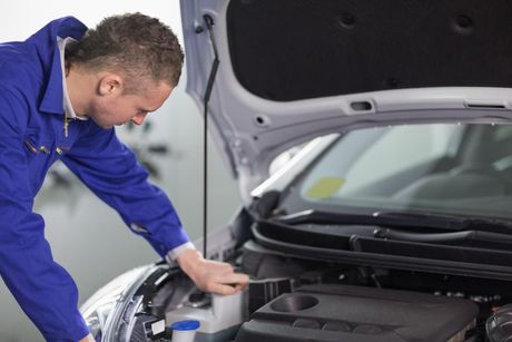 mechanic checking the car engine