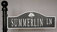 A black and white street sign for summerlin ln