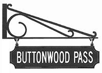 A black and white sign that says buttonwood pass on a white background.