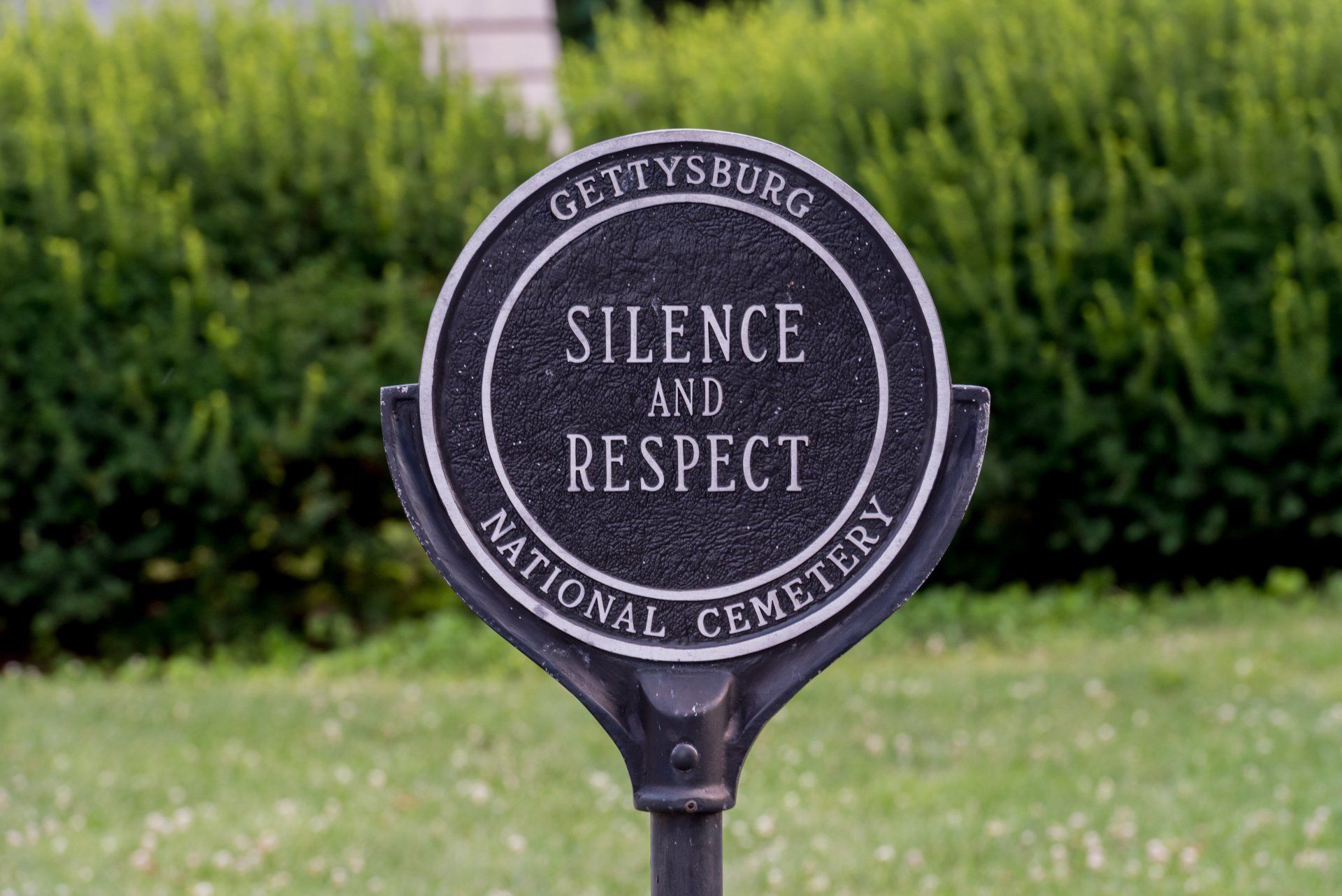 A sign that says silence and respect on it