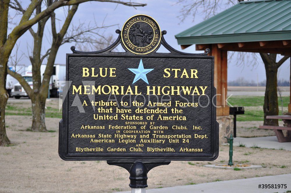 A sign that says blue star memorial highway on it
