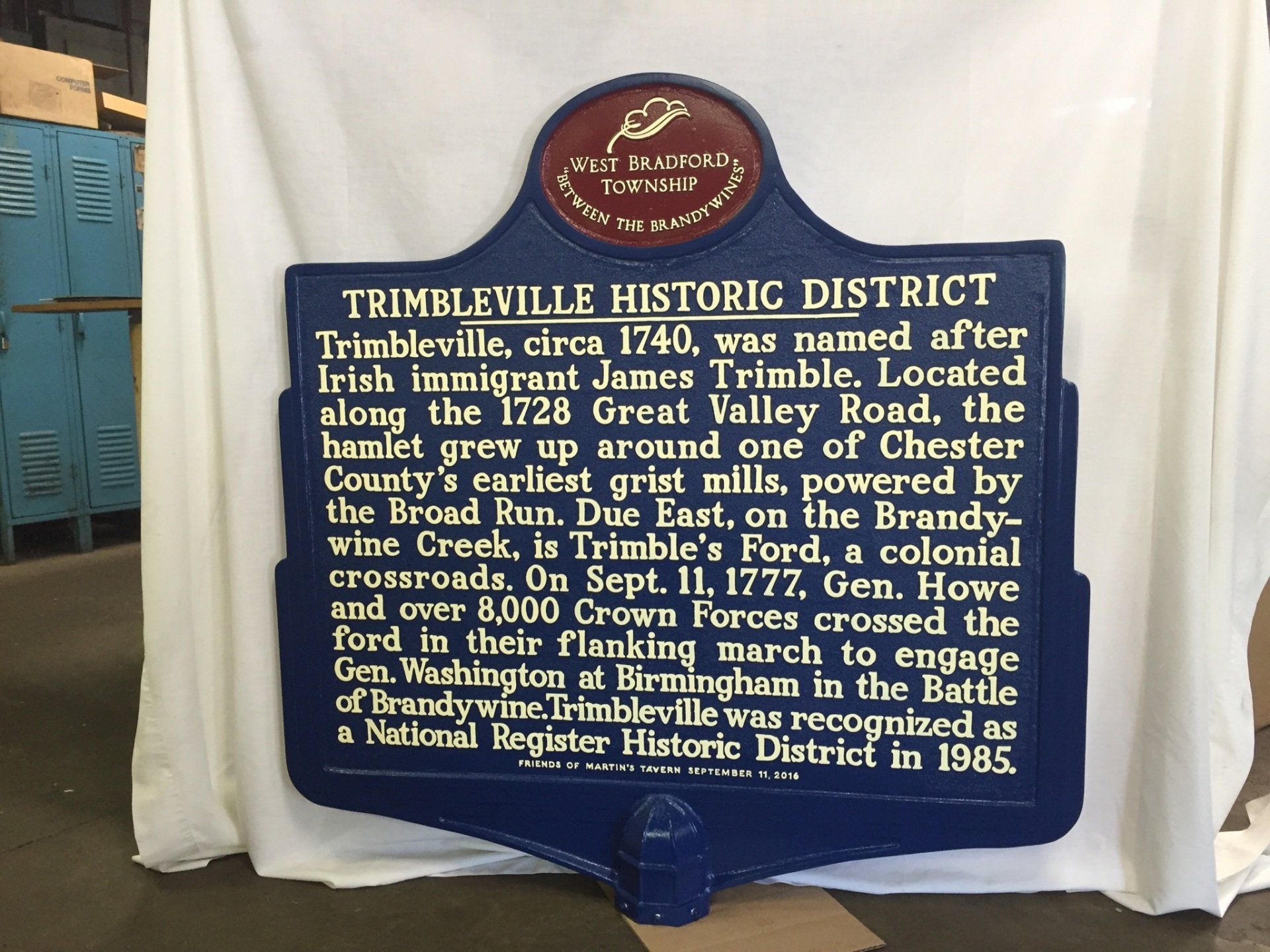 A blue sign that says trimbleville historic district on it
