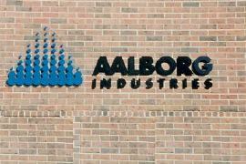 A brick wall with aaalborg industries written on it