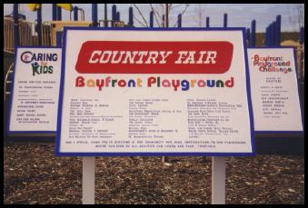 A sign for the country fair bayfront playground