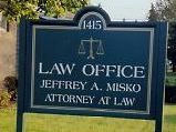 A sign for the law office of jeffrey a. misko attorney at law.