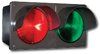 A red and green traffic light on a white background.