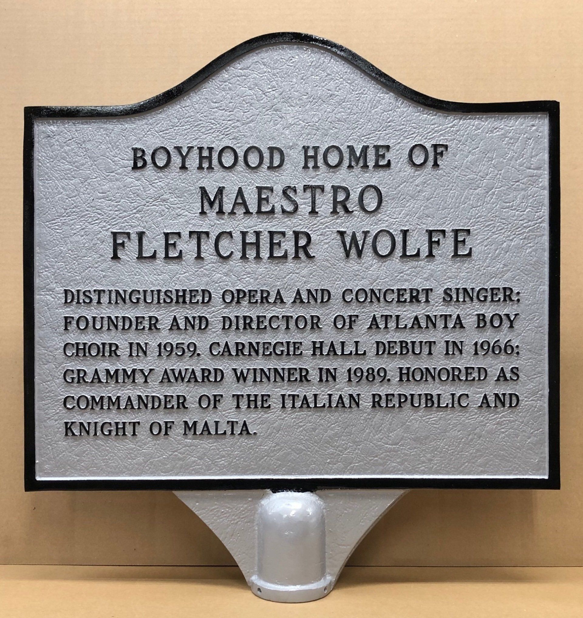 A sign that says boyhood home of maestro fletcher wolfe