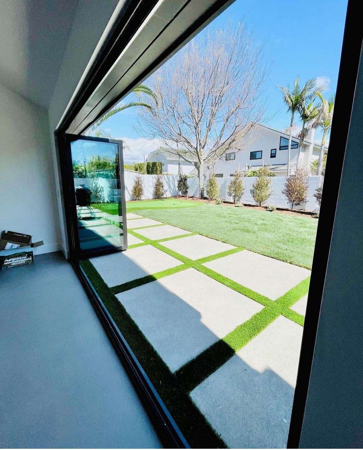 A view of a backyard through a sliding glass door