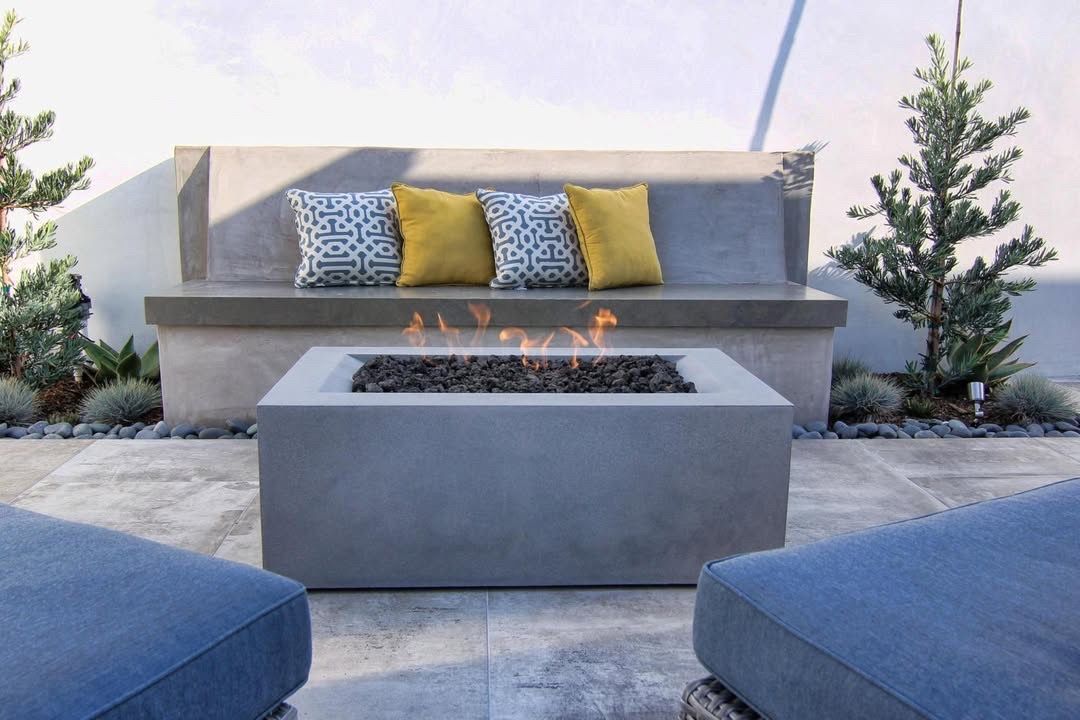 There is a fire pit in the middle of the patio.