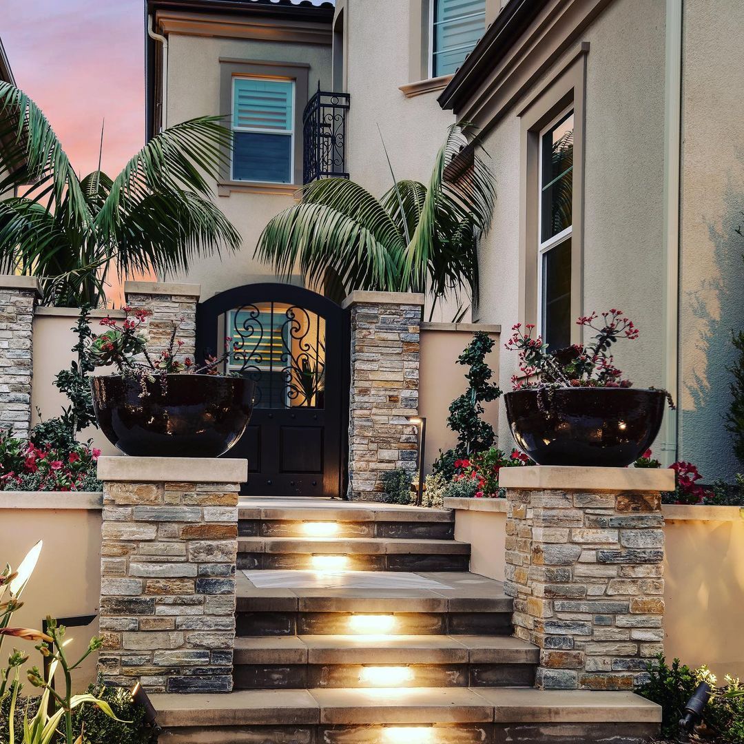 A house with stairs leading up to the front door