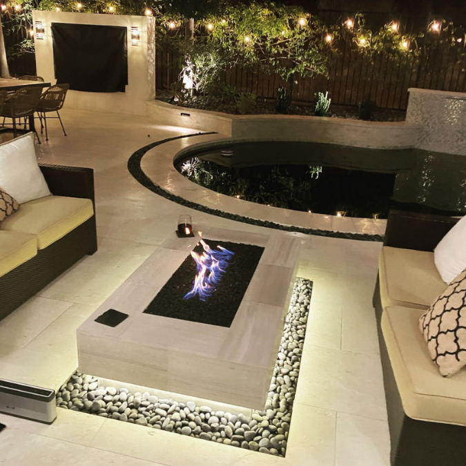 A living room with a fireplace and a couch