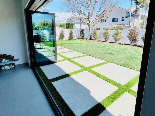 A view of a backyard through a sliding glass door