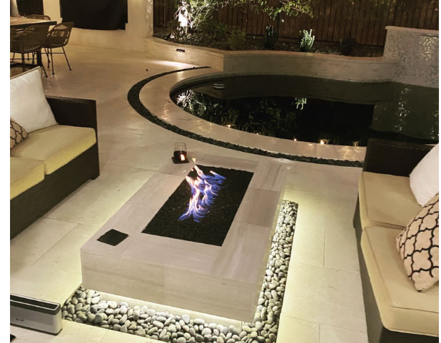 A living room with a fireplace and a couch